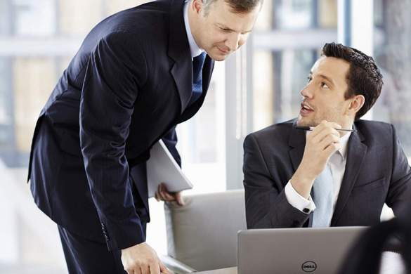 Caucasian males at a desk in an office with a Dell Latitude 14 7000 Series (Model E7440) 14-inch laptop / notebook computer.