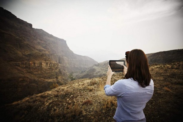 154532196 Woman Taking Photo with Venue 11 Pro Tablet